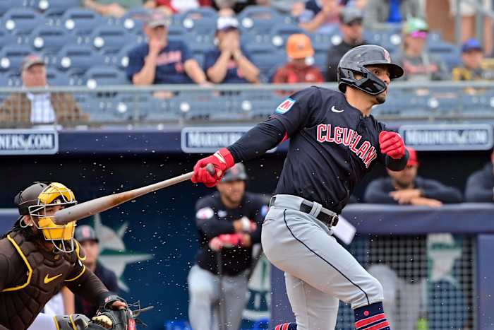 Feb 26, 2024; Peoria, Arizona, USA; Cleveland Guardians second baseman Andres Gimenez (0) grounds out in the first inning against the San Diego Padres during a spring training game at Peoria Sports Complex.